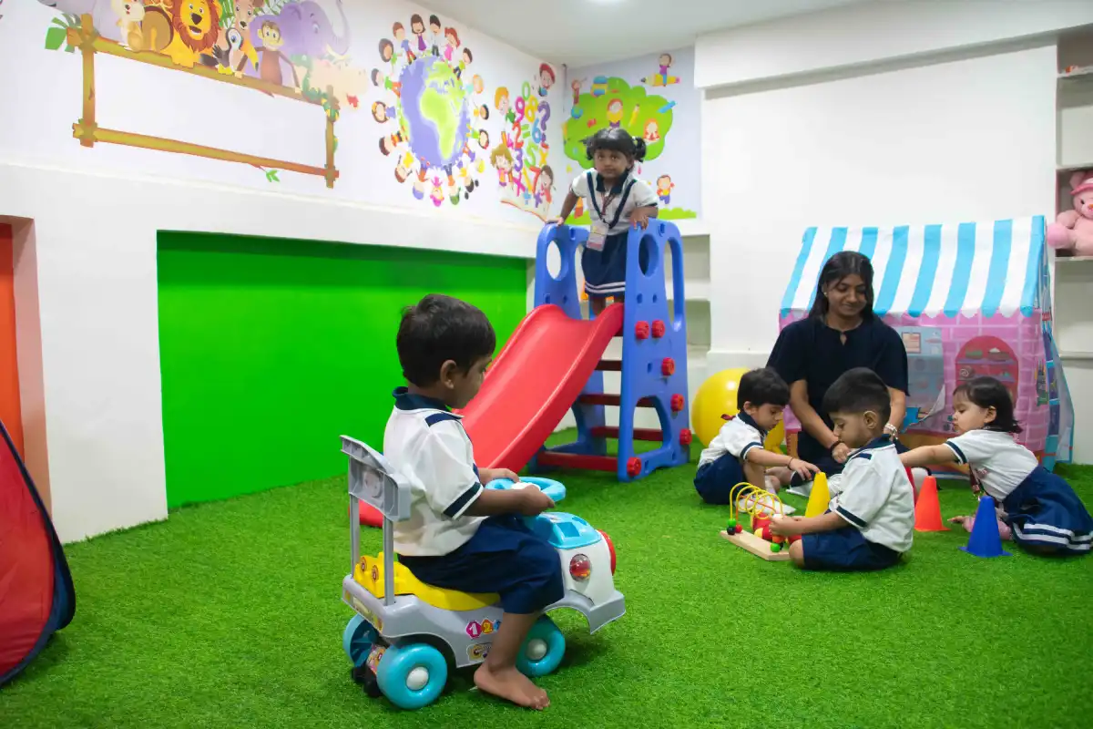 Child smiling on the first day of school in a colorful preschool environment