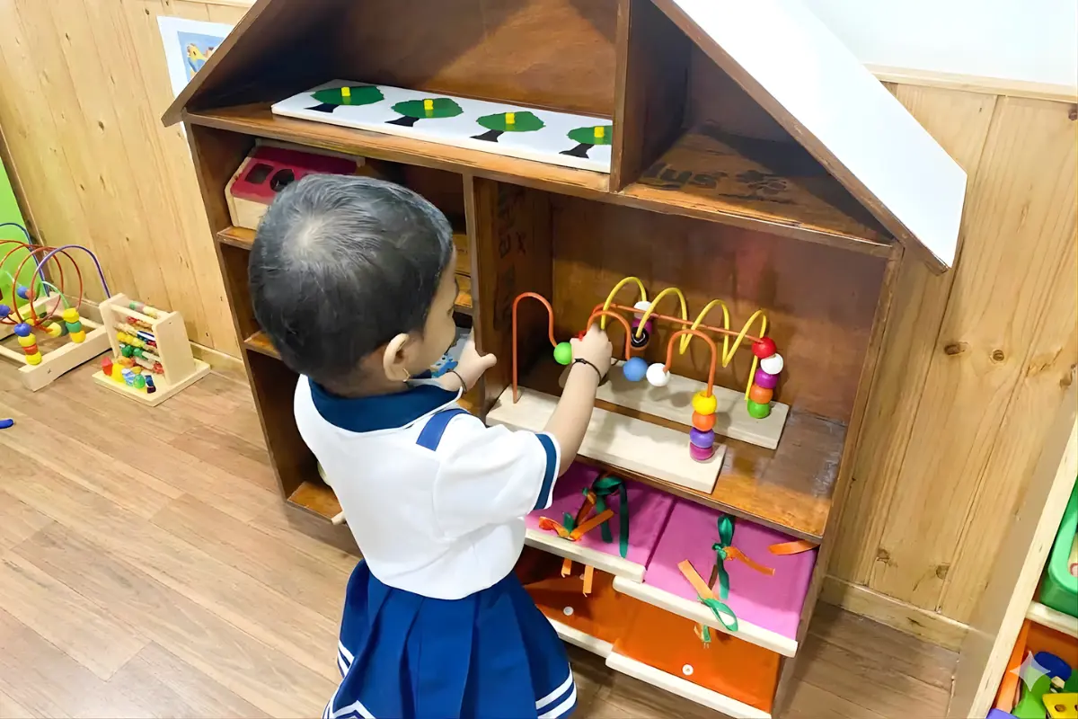 Preschool children learning between activities through daily routines, social interaction, and guided transitions in a nurturing classroom environment.