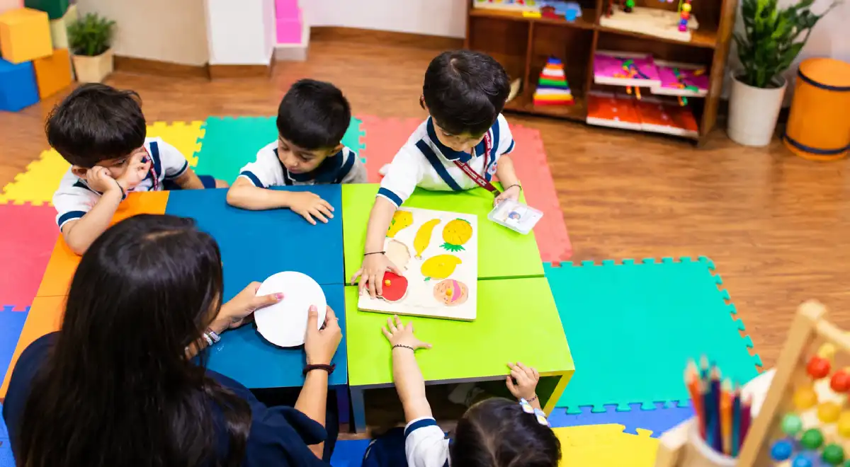 Children participating in a creative classroom activity with a teacher