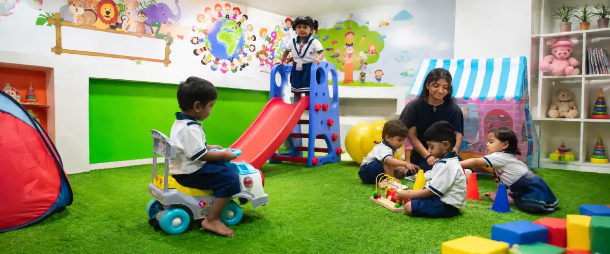 Young children playing and learning together during an indoor classroom activity